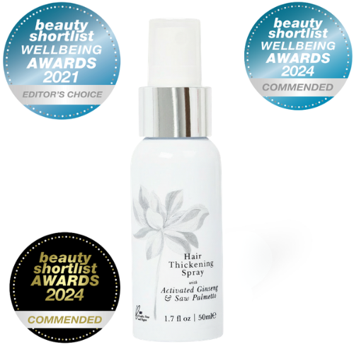 Hair thickening spray bottle with awards badges on a white background
