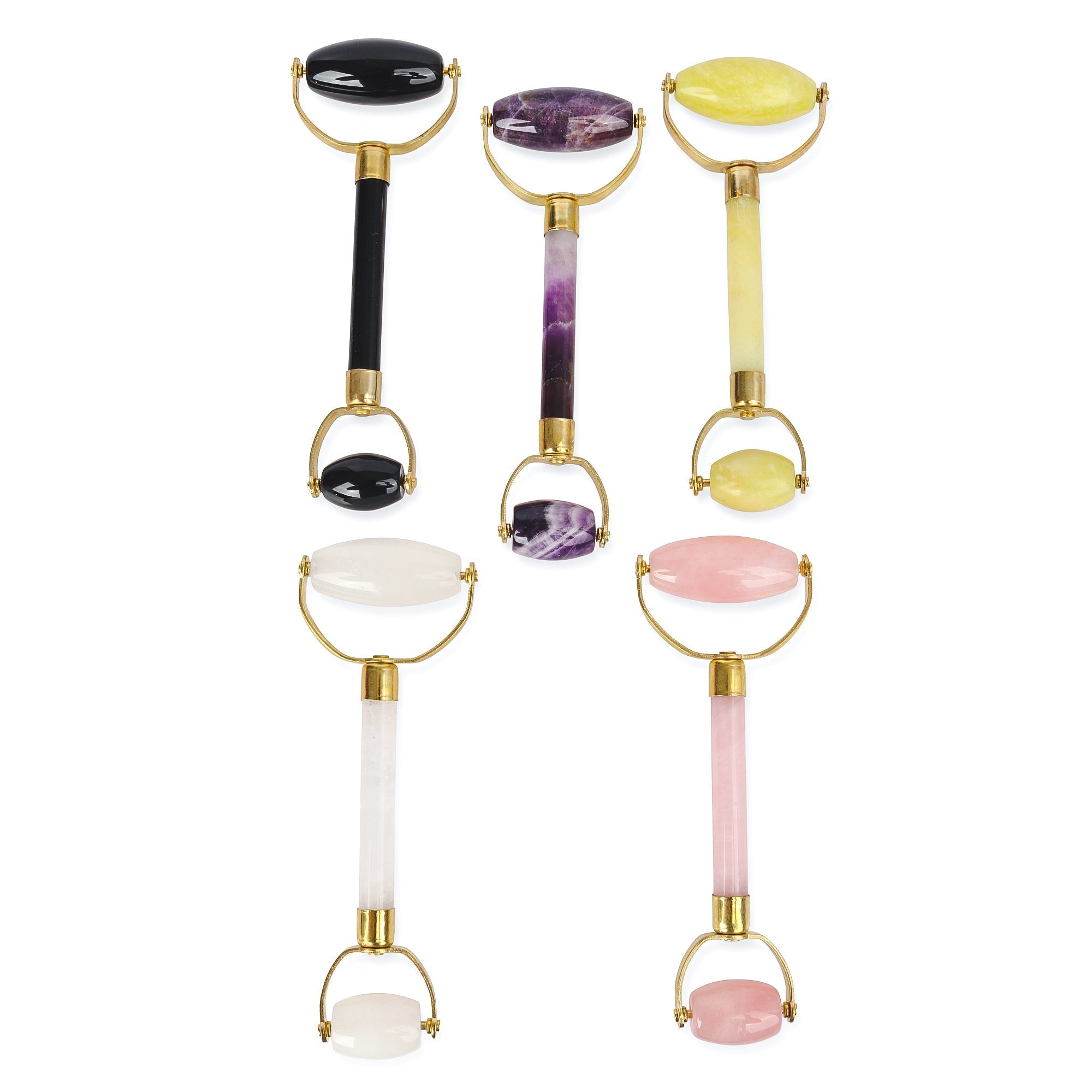White Lotus crystal facial rollers in jade, amethyst, rose quartz, black obsidian and white quartz with gold metal safety brackets